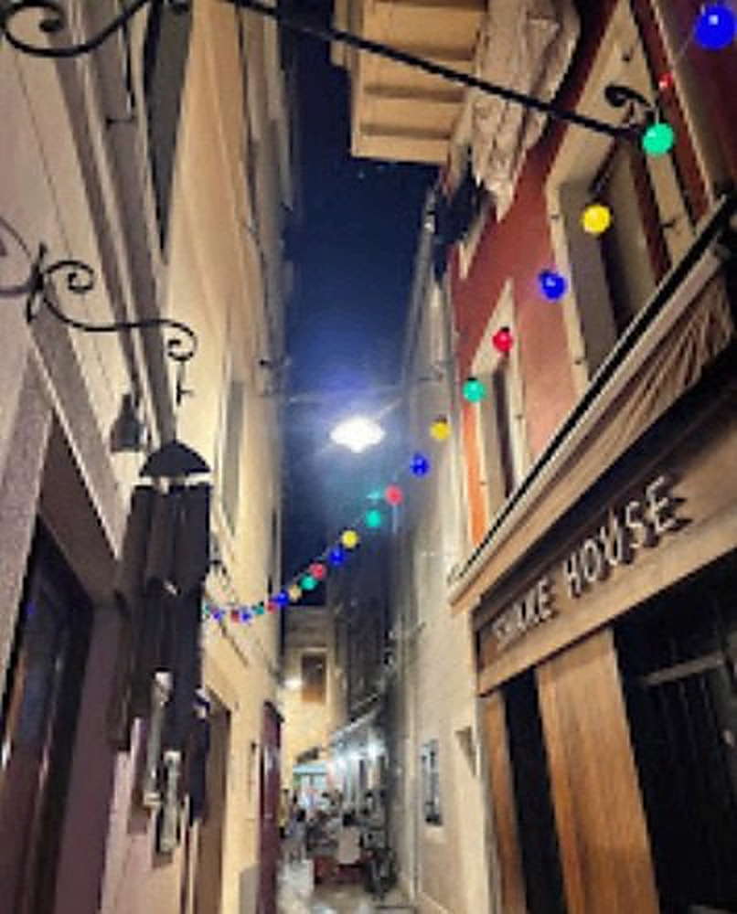 Zadar alley outside the bar strung with coloured lights