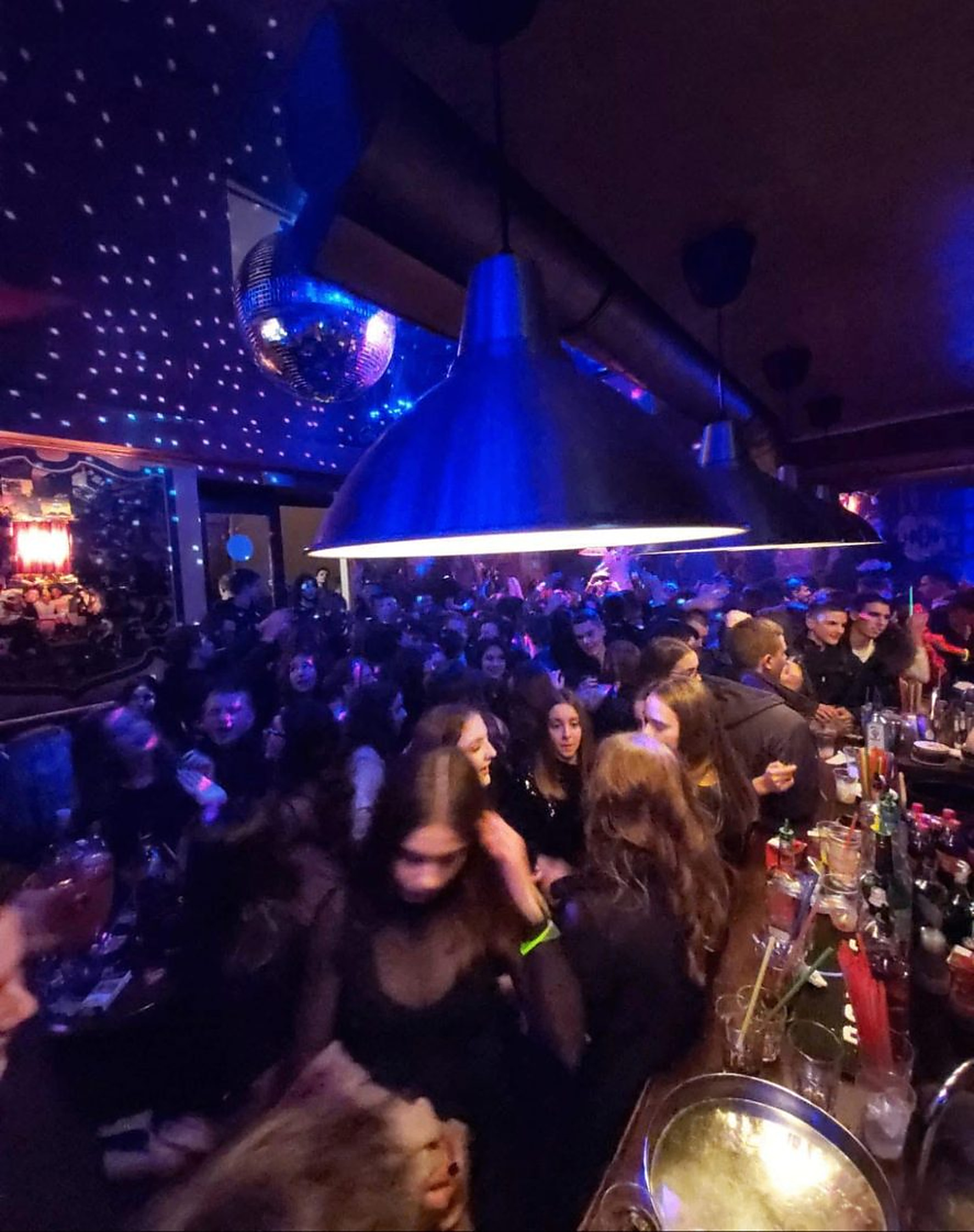 Busy night at Dolce Vita under blue and red light